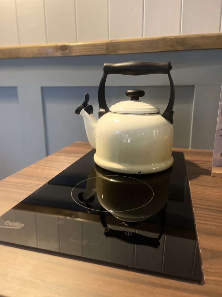 A le creuset kettle on an induction hob