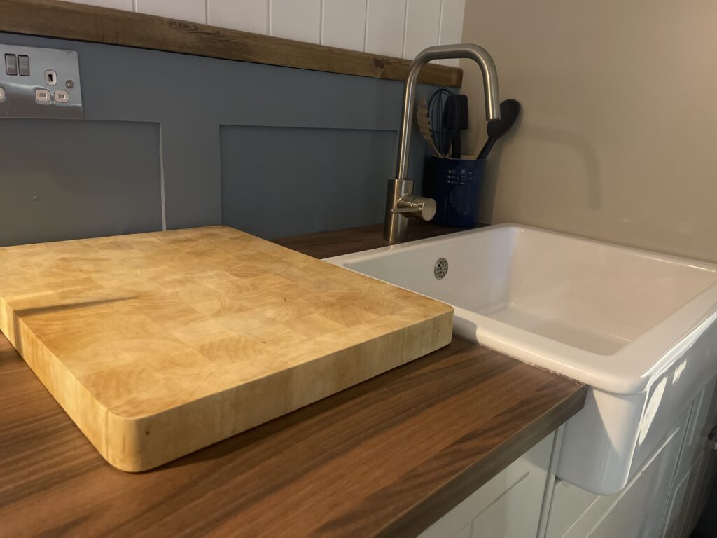 A photo of the kitchen surface and sink in a Herdwick shepherd hut from Moorlands Garden Furniture